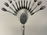 a lot of forks arranged in the shape of a fan