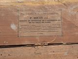 a wooden box with a sign on it that says f south