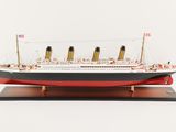 a model of a large ship on a wooden stand