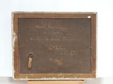 a blackboard with writing on it sitting on a wooden stand