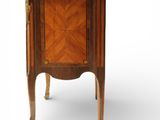 an antique wooden cabinet with marble top and legs