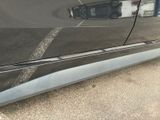 a close up of a car door with a parking meter on it