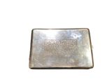 a silver plate with a design on it on a white background