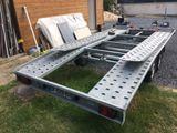 an image of a flatbed trailer with a mattress on the back