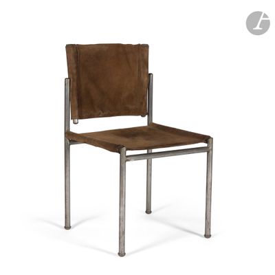 the chair is made of metal and has a brown leather seat