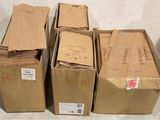 several cardboard boxes are stacked on top of each other on the floor