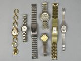 a lot of watches that are sitting on a table