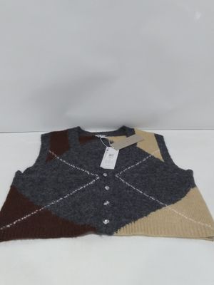 an image of a sweater with a tag on it