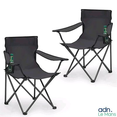 pair of black folding chairs with a bottle of beer on each of them