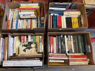 boxes of books are stacked on top of each other on a table