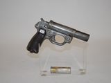 a small gun that is on display on a clear stand
