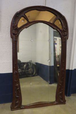 a mirror that is sitting on the floor in a room