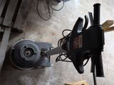 a machine that is sitting on the floor next to a pallet