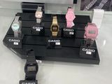 a lot of watches on display in a glass case