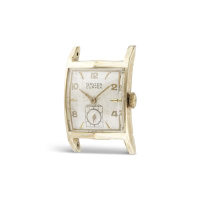 une image représentant une montre en or avec un cadran blanc