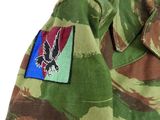 an image of a close up of a military jacket with a eagle patch on it