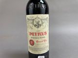 a bottle of wine that is sitting on a table