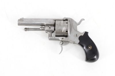 a close up of a revolver on a white surface with a white background