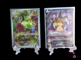 two pokemon cards on display on a black background