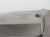 a close up of a knife with a metal handle