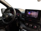 the interior of a car with a steering wheel, dashboard, and display screen