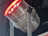 a red light that is on the side of a building