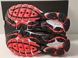 the soles of a pair of running shoes on a white surface