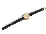 an image of a wrist watch on a white surface with a white background