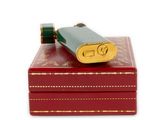 a red box with a lighter on top of it