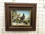 peinture représentant un chat et un oiseau sur un mur de briques
