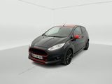 a black and red ford fiesta parked in a white room