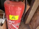 a fire extinguisor in the corner of a garage