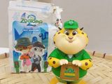 a small figurine of a man holding a box of food