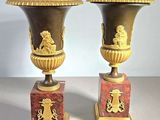 two vases sitting on top of each other on a table