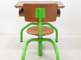 a green desk and a brown chair in a room