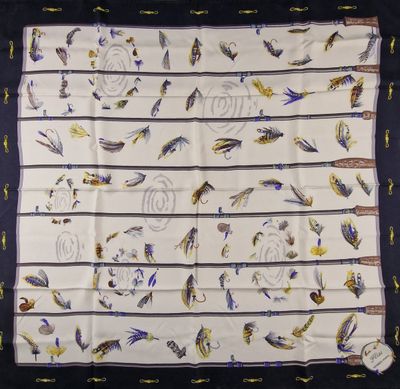 an image of a white scarf with blue and yellow birds on it