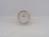an image of a small glass object on a white surface