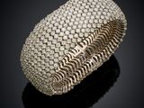 a white gold and diamond cuff bracelet