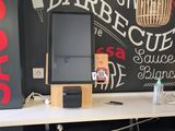 a blackboard on the wall of a restaurant with a chalkboard behind it