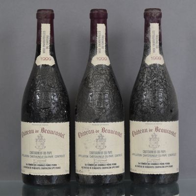 three bottles of wine are lined up on a glass shelf