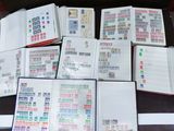 a lot of stamps on the pages of a book