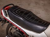 a close up of a motorcycle with a seat on it