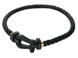 a close up of a black leather bracelet with a metal clasp