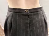 a close up of a person ' s torso wearing a suit and tie