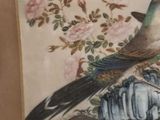 a painting of a bird sitting on top of a rock