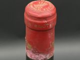a close up of a bottle of wine on a table