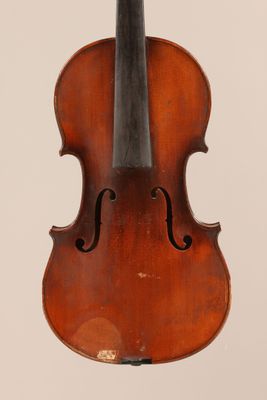 an old violin with a bow hanging from it ' s back