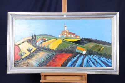 un tableau posé sur un chevalet représentant une ferme