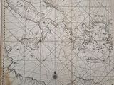 an old map of the world with a compass on it