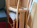 two chairs and a table in the corner of a room